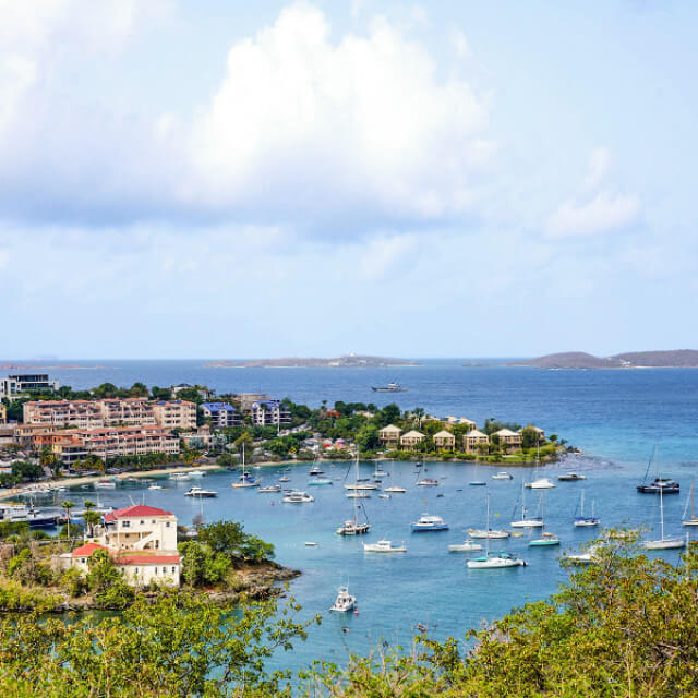 Boats wait off the coast of St. John in the U.S. Virgin Islands