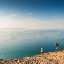 Running along sand dunes in Traverse City, Michigan
