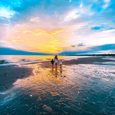 Walking on a Connecticut beach at sunset