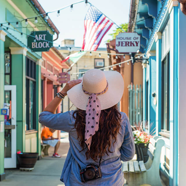 Walking by colorful storefronts in Cape May, New Jersey