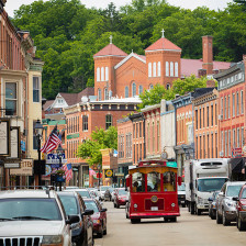 A trolley drives down a historic street in Galena, Illinois