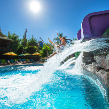 Enjoying a water slide at Universal's Volcano Bay Water Theme Park in Orlando, Florida
