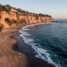 Walking on the beach near Greyhound Rock in Santa Cruz, California