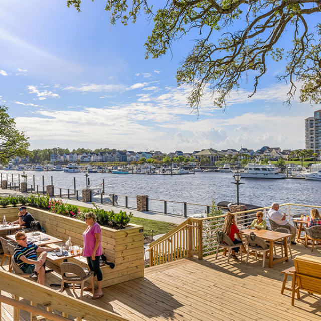 Deck dining with waterway views at Big Chill Island House in North Myrtle Beach, South Carolina