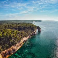 Kayaking the clear waters of Pictured Rocks National Lakeshore in Munising, Michigan